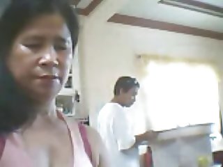 Filipino woman want show her tits but son beside her