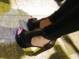 Candid high heels and sexy red toenails