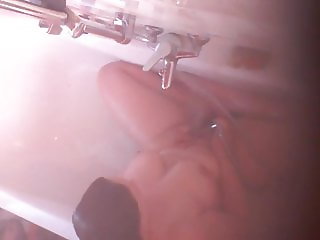 Hidden Cam caught her masturbating with the water jet in the bathtub