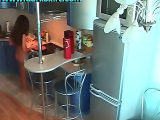 Young babe walks naked in kitchen hidden cam